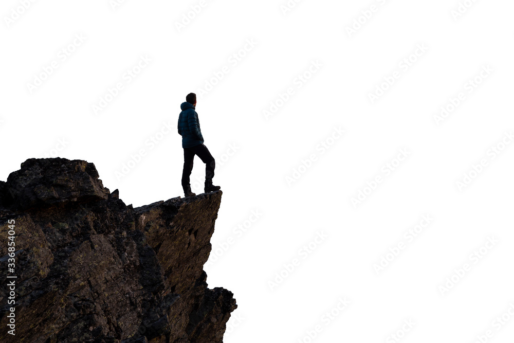 Adventurous Man Hiker Standing on top of a Steep Rocky Cliff. White Background Isolated Cutout. Perfect for Image Composites. Graphic Resource. Concept: Adventure, Explore, Hike, Lifestyle