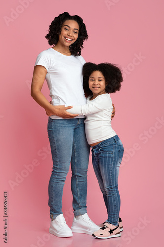 Mother Daughter Connection. Cute Little Black Girl Cuddling Her Loving Mom