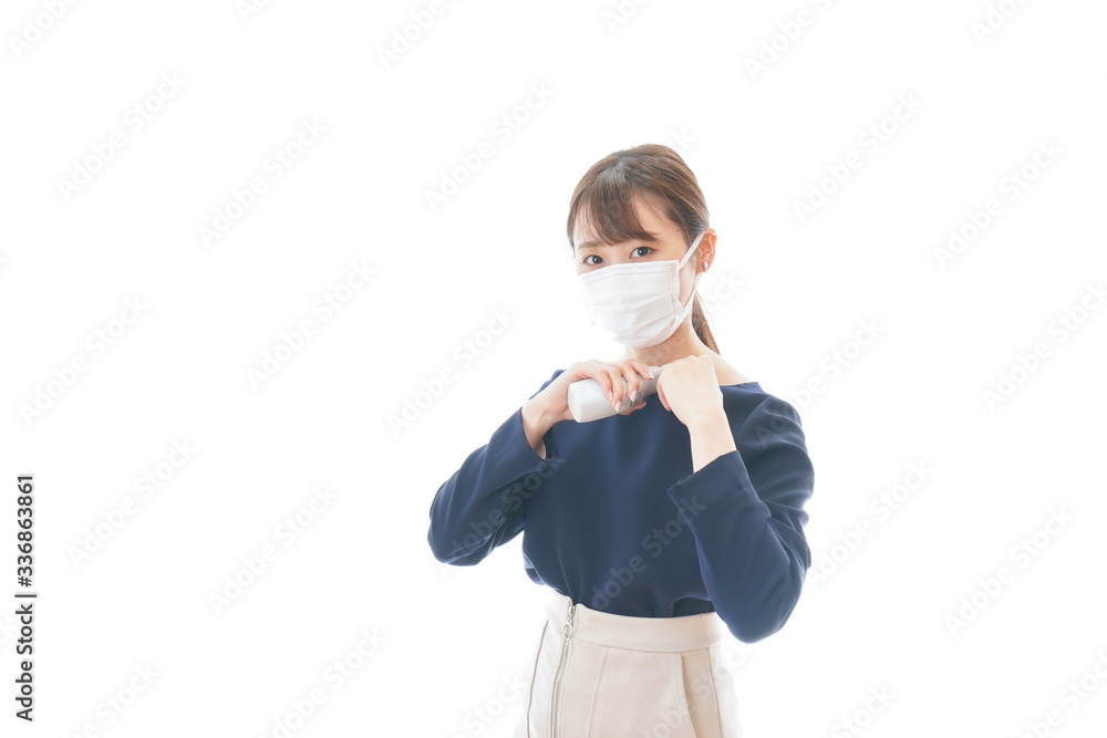 体温の測定をする若いビジネスウーマン 体温の測定をする若いビジネスウーマン