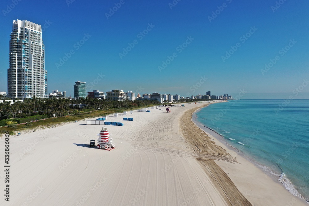 Aerial view of South Beach in Miami Beach, Florida devoid of people under coronavirus pandemic beach and park closure. Aerial view of South Beach in Miami Beach, Florida devoid of people under coronavirus pandemic beach and park closure.