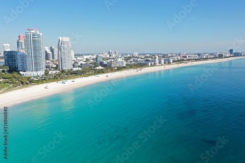 Aerial view of South Beach in Miami Beach, Florida devoid of people under coronavirus pandemic beach and park closure. © Francisco