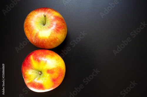 Apples on black table, food background