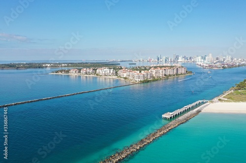 Government Cut jetties and Fisher Island on clear sunny morning with City of Miami skyline in background. © Francisco