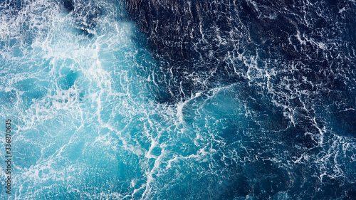Abstraction of sea foam in the ocean. Turquoise light water.