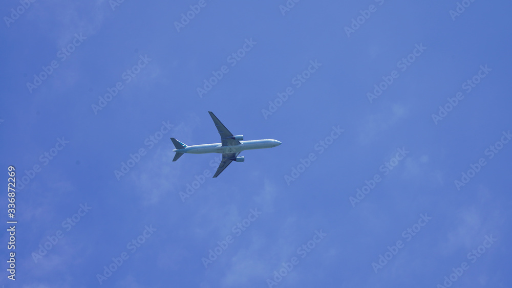 passenger plane on a background of blue sky. flying airliner comes in for a landing. plane in the deep sky with clouds passenger plane on a background of blue sky. flying airliner comes in for a landing. plane in the deep sky with clouds