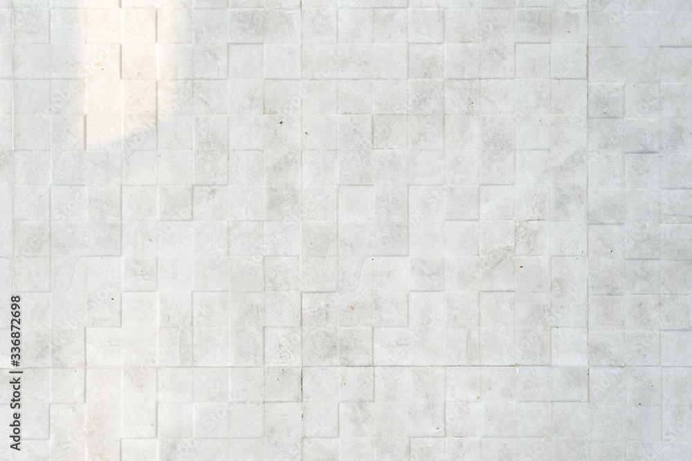 White stone square grid texture background. Clean and luxuty surface top view. White stone square grid texture background. Clean and luxuty surface top view.