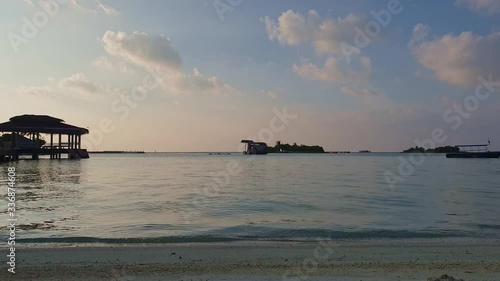 View from seashore of small port for mooring boats in Maldives at sunset photo