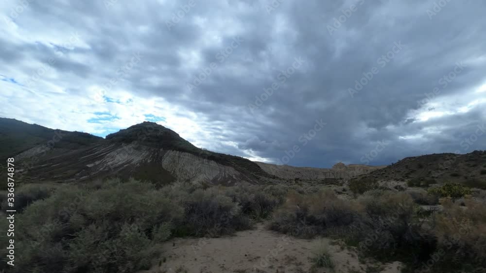 Clip of desert with clouds in Red Rock Canyon National Conservation Area. Redrock video shot by a a car moving Clip of desert with clouds in Red Rock Canyon National Conservation Area. Redrock video shot by a a car moving
