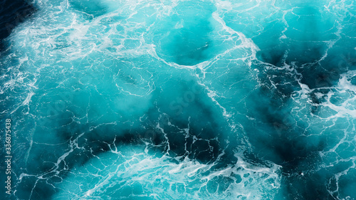 Abstraction of sea foam in the ocean. Dark water, storm waves