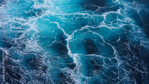  Abstraction of sea foam in the ocean. Dark water, storm waves © Artem