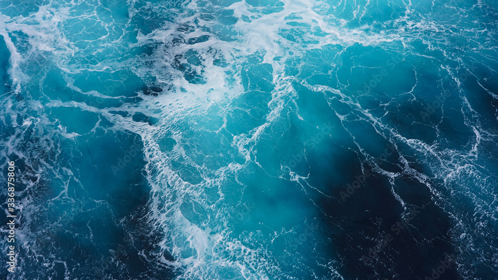 Fototapeta premium Abstraction of sea foam in the ocean. Dark water, storm waves