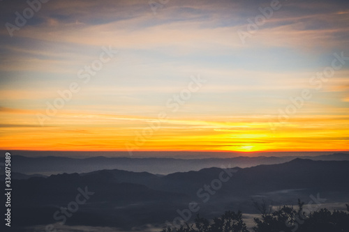 sky shading in the morning from orange to blue © Pop