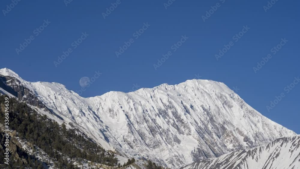 Moon Setting over Tilicho Peak Timelapse. Tight Shot