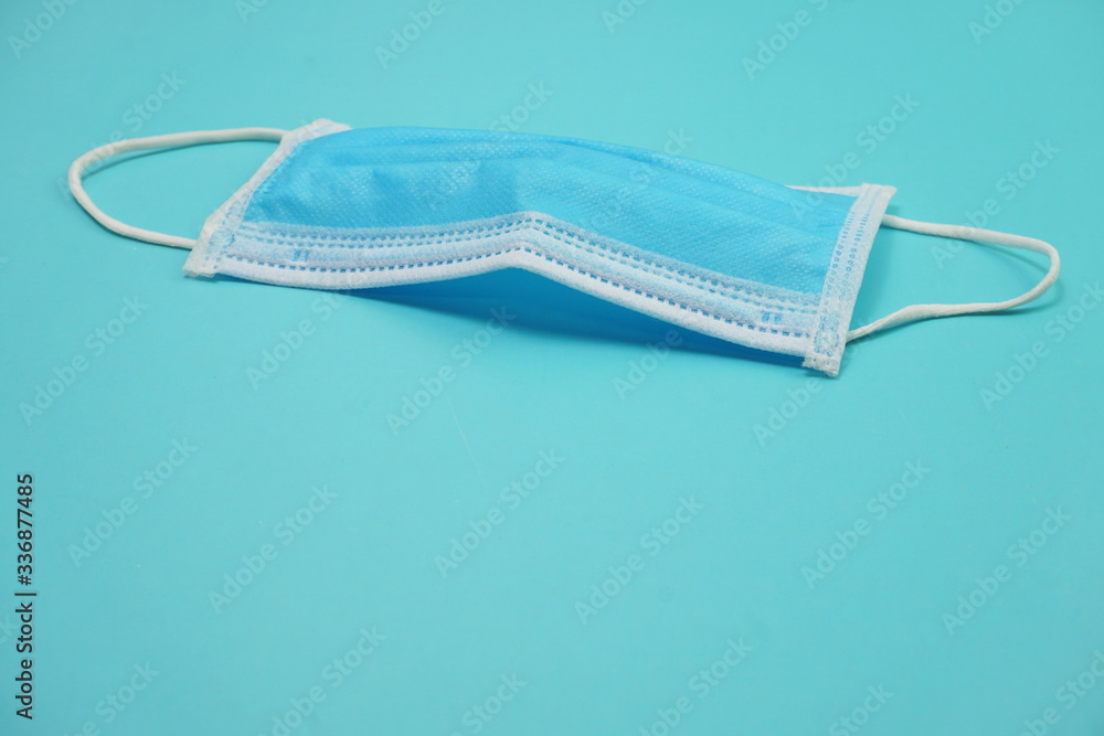 Medical Mask with space copy on blue background Medical Mask with space copy on blue background