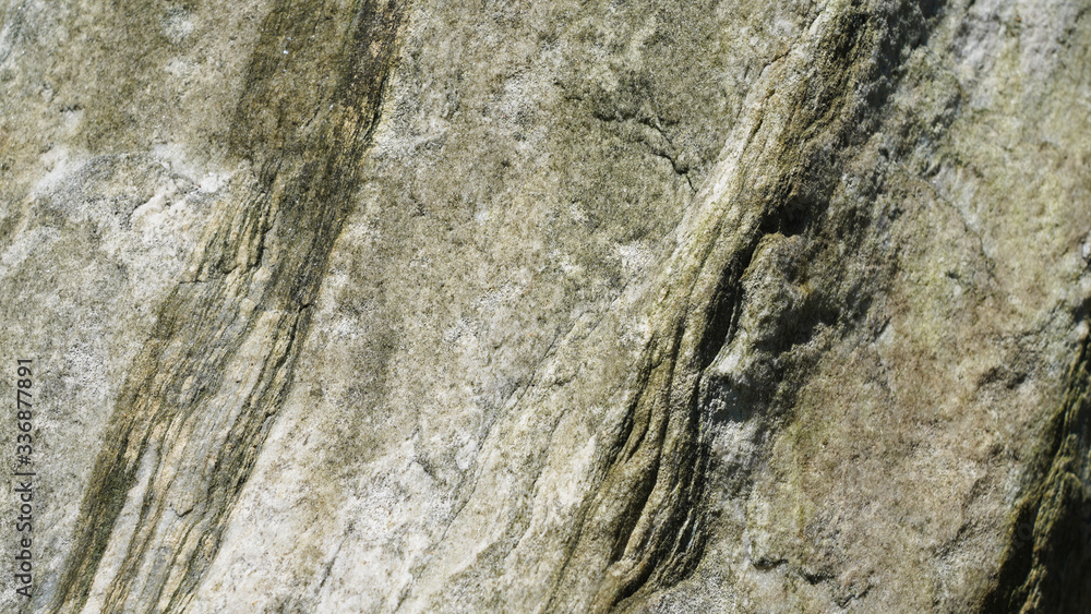 Stone texture, abstract background, uneven lines, bends of stone layers. Natural pattern composition.