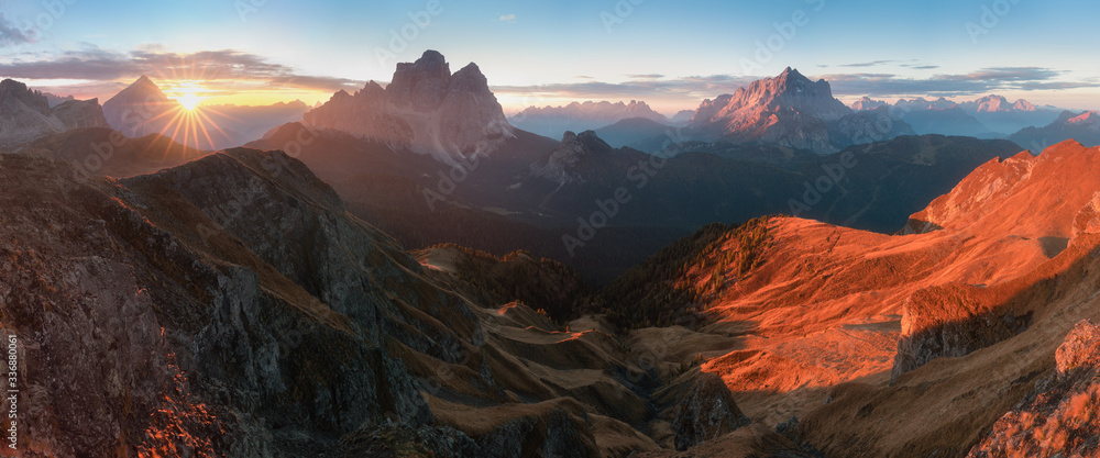 View of famous Dolomites mountain peaks glowing in beautiful golden morning light at sunrise in summer, South Tyrol,Italy
Monte Pelmo and Monte Civetta in sunny day.
Famous best alpine place