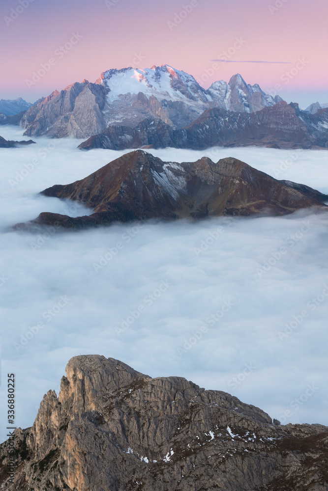 View of famous Dolomites mountain peaks glowing in beautiful golden morning light at sunrise in summer, South Tyrol,Italy
dramatic view of dolomites mountains above the clouds
Famous best alpine place
