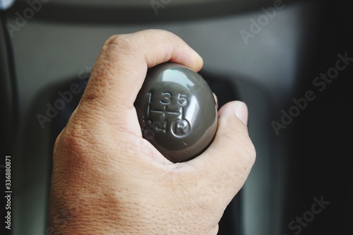 hand with the car gear shift