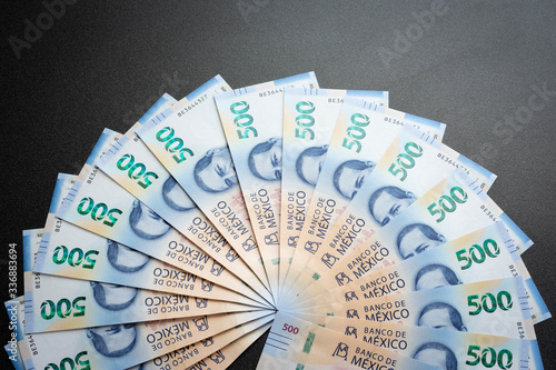 Mexican 500 pesos pile of blue bucks hand fan