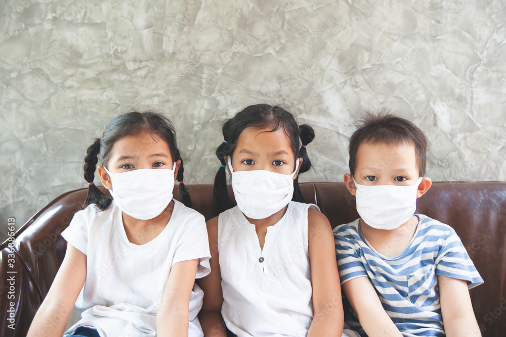 Asian children boy and girls wearing protection mask stay at home quarantine from the coronavirus Covid-19 and air pollution pm2.5.