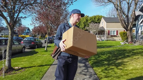 Mailman delivering package to doorstep 