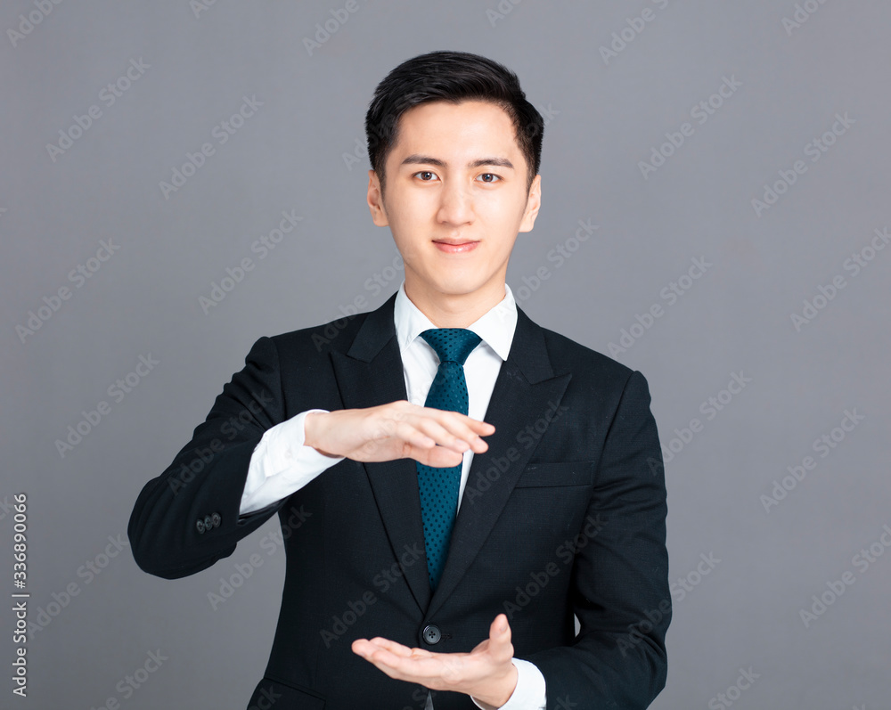 young business man with holding and showing gesture young business man with holding and showing gesture