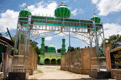Green building of Masjid Nurul Rahmah mosque in rural of lower southern province of thailand for thai and foreigner muslim visit and respect praying allha in Narathiwat, Thailand photo