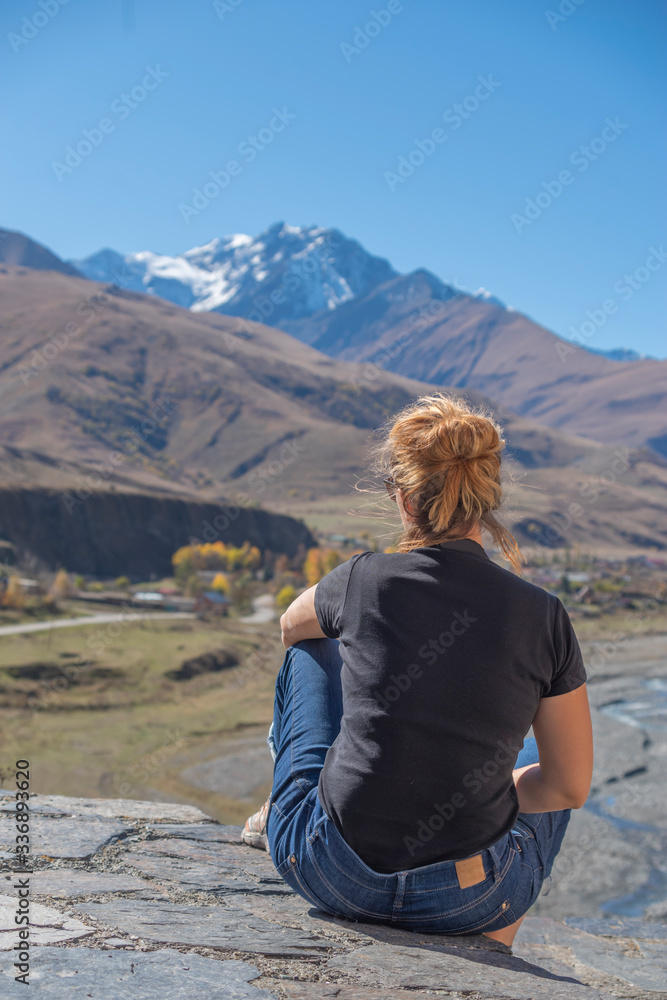 girl on the background of Mount Kazbek. North Ossetia .