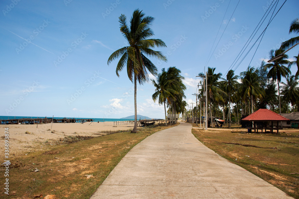 View landscape and coconut tree at Banton Beach and village in lower southern Narathiwat provinces, Thailand