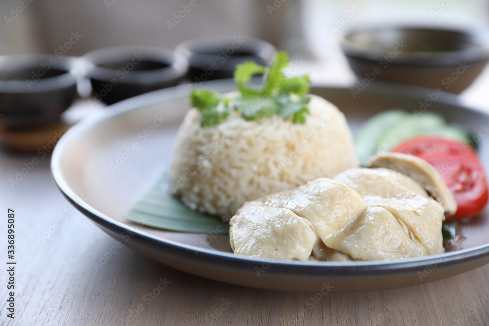 Thai food gourmet steamed chicken with rice , khao mun kai in wood background Thai food gourmet steamed chicken with rice , khao mun kai in wood background