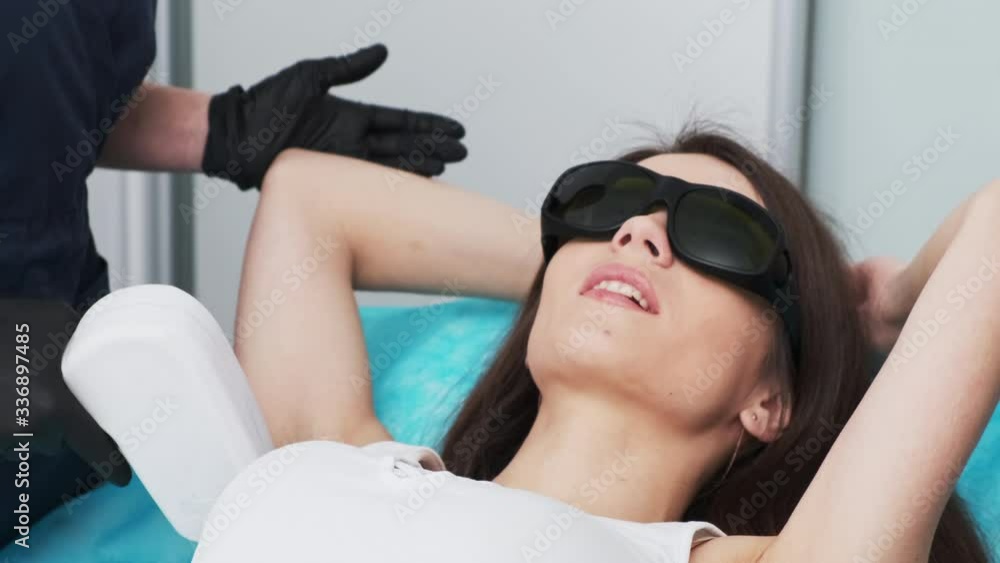 Pretty Girl Receives Laser Hair Removal Procedures In Beauty Studio
