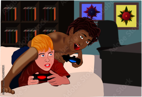 boys playing video games on the sofa