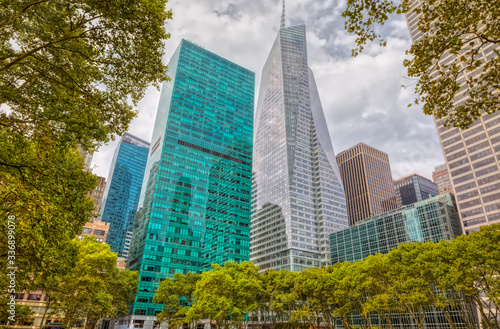 Surrounding buildings and skyscrapers visible from the Bryant Park during the gloomy weather in Manhattan, New York