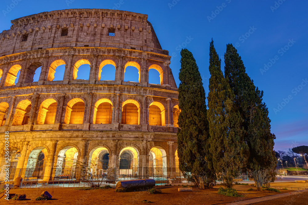 The illuminated Colosseum in Rome at twilight