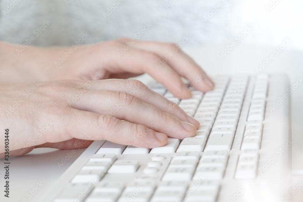 Man hands typing on computer keyboard, business man working on pc in office. Close-up Man hands typing on computer keyboard, business man working on pc in office. Close-up