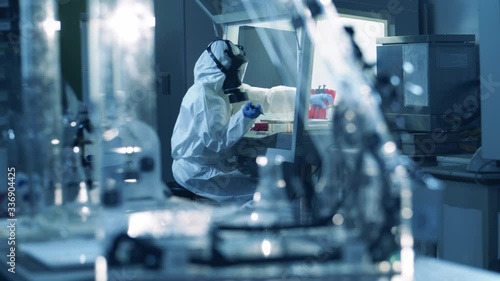 Wallpaper Mural A virologist uses pipette while working with covid-19 in a tube. Coronavirus, COVID-19, 2019-ncov medicines research concept. Torontodigital.ca