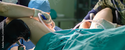 Valokuva Surgeon doctor in operating room during gynecological biopsy