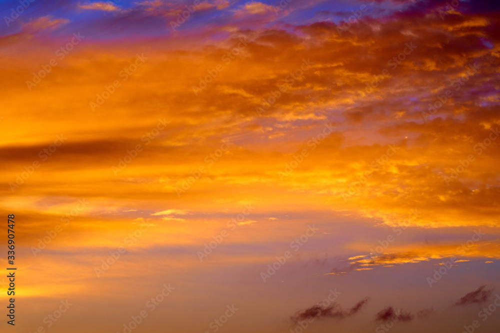 Incredibly colorful sunset on the tropical beach. Abstract nature background.
