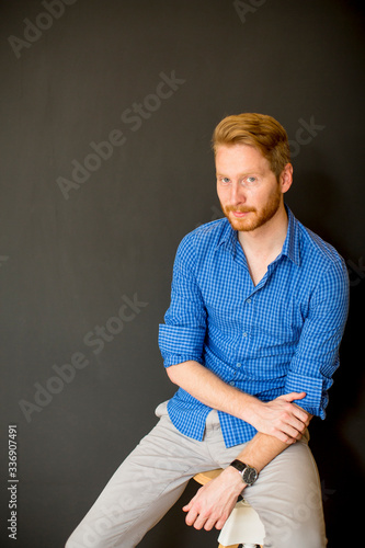 Redhair man sitting by the ...