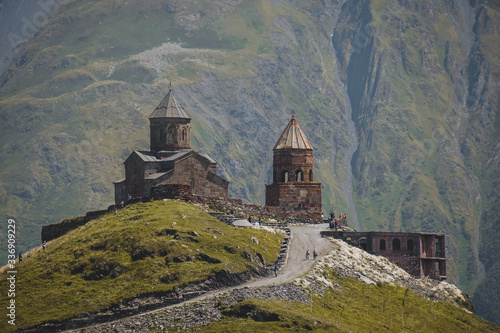 Ancient Gergeti Trinity church Tsminda Sameba, near mount Kazbek, a landmark of Georgia in Caucasus mountains.