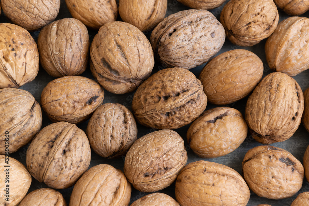 Whole raw walnuts, healthy eating ingredients, vegan and vegetarian food Whole raw walnuts, healthy eating ingredients, vegan and vegetarian food