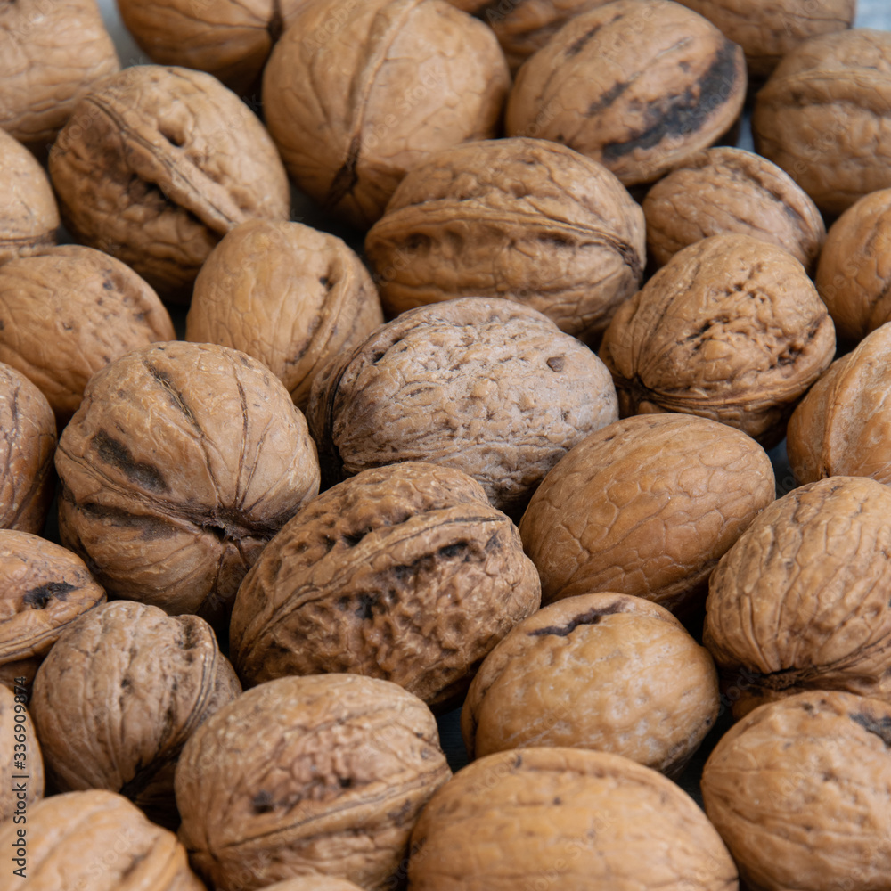 Whole raw walnuts, healthy eating ingredients, vegan and vegetarian food Whole raw walnuts, healthy eating ingredients, vegan and vegetarian food