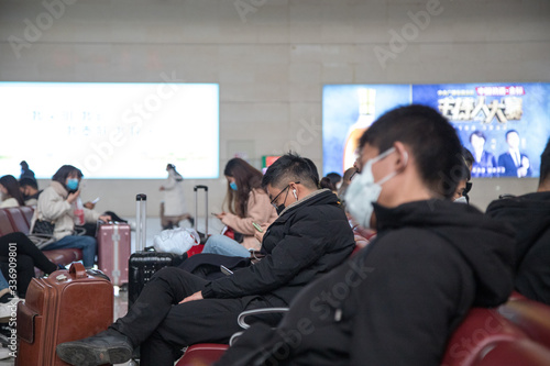 Random people in Zhengzhou Railway Station during coronavirus pandemic