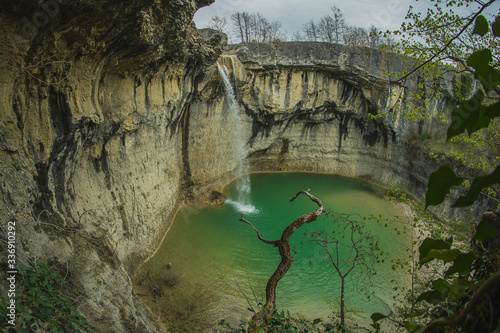 Sopot waterfall in Istria, Croatia, a popular tourist destination in the middle of Istrian countryside. 30 meter high waterfall with old arched bridge above it. photo