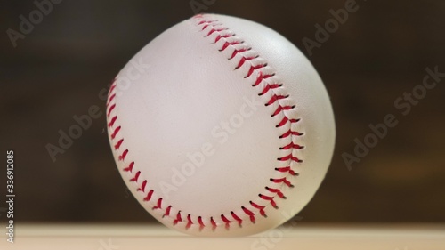 Baseball rotating on the black background. Close up.