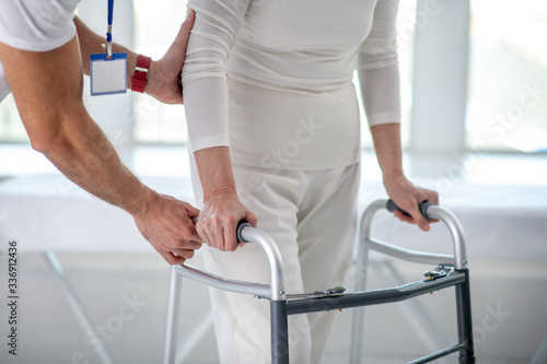 Close up of a female patient using walkers