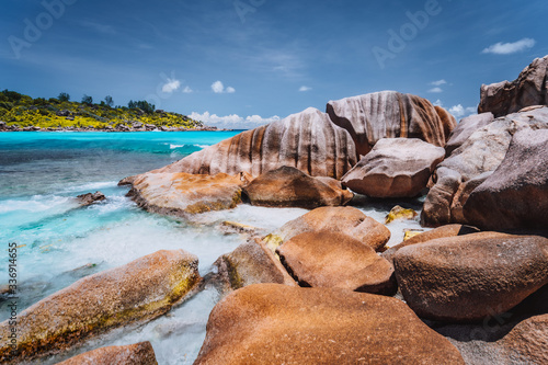 Tropical beach at Seychelles. Rocks on shore of La Digue Island