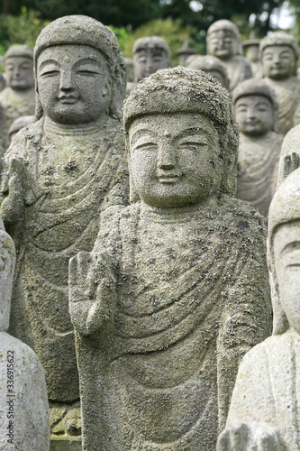 Buddha statues standing in line