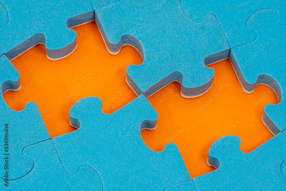 Blue jigsaw puzzle with two missing pieces Blue jigsaw puzzle with two missing pieces