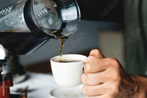 Pouring hot coffee drink